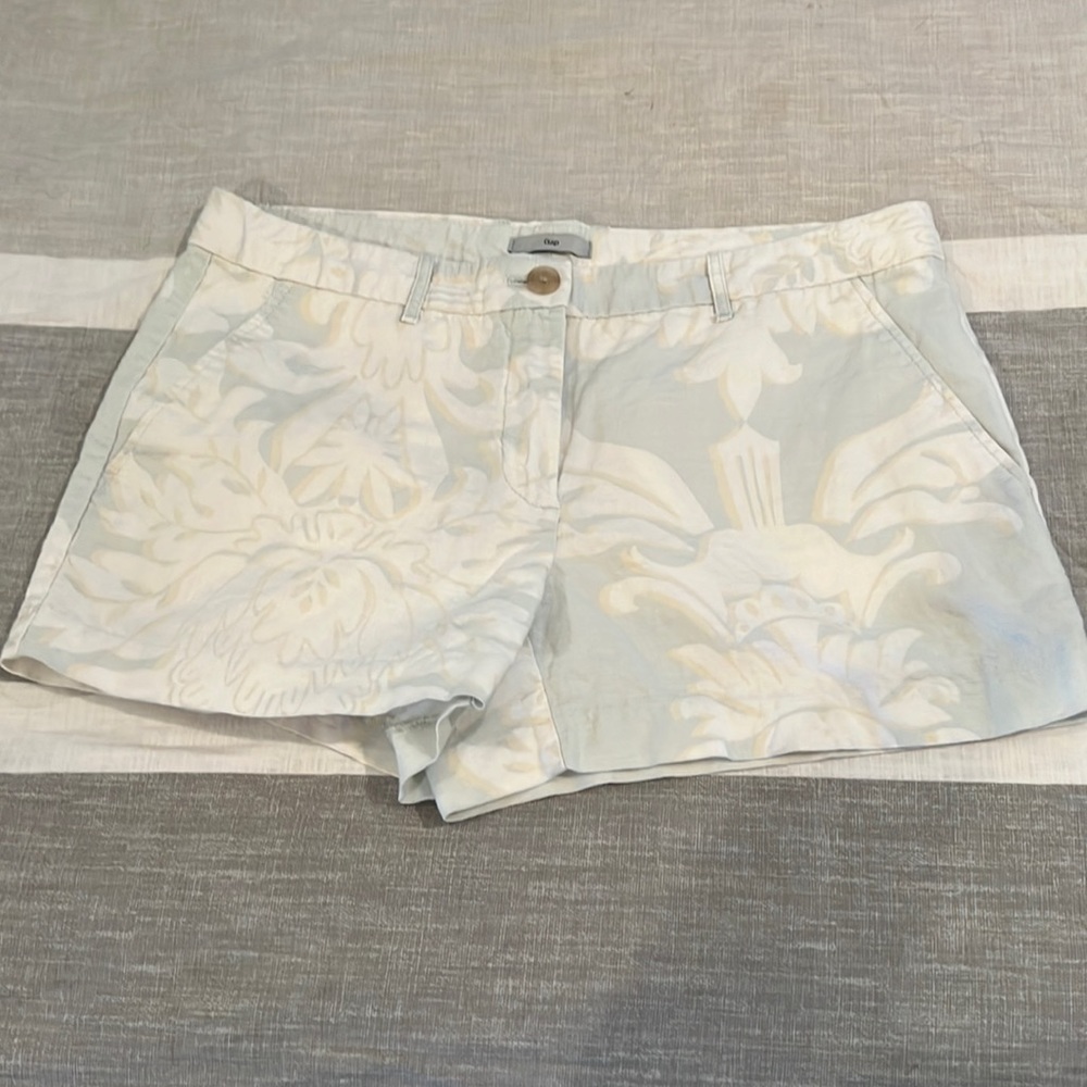 Pale blue/green with white and tan floral design